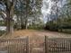 Large backyard with mature trees and a wooden fence at 1764 Thomas Ter, Decatur, GA 30032