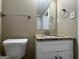 Bathroom with granite vanity, toilet and a mirror reflecting a shower at 1764 Thomas Ter, Decatur, GA 30032