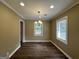 Bright dining area with wood floors and a chandelier at 1764 Thomas Ter, Decatur, GA 30032
