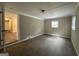 Spacious bonus room with exposed brick wall and tile floors at 1919 Glenmar Dr, Decatur, GA 30032