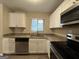 Modern kitchen with white cabinets and granite countertops at 1919 Glenmar Dr, Decatur, GA 30032