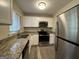 Updated kitchen, featuring stainless steel appliances and granite countertops at 1919 Glenmar Dr, Decatur, GA 30032