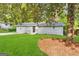 Charming ranch home with gray siding and green lawn at 1919 Glenmar Dr, Decatur, GA 30032