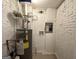 Unfinished laundry area with water heater and electrical panel at 1919 Glenmar Dr, Decatur, GA 30032