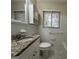 Clean bathroom with granite countertop, updated vanity, and a shower/tub combo at 1919 Glenmar Dr, Decatur, GA 30032