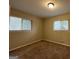 Bright bedroom with neutral walls and carpet flooring and two windows at 1919 Glenmar Dr, Decatur, GA 30032