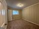 Well-lit bedroom featuring neutral walls and carpet flooring at 1919 Glenmar Dr, Decatur, GA 30032