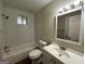 Clean bathroom with a bathtub, toilet and vanity at 4433 Mercer Rd, Decatur, GA 30035