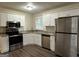 Modern kitchen with white cabinets and granite countertops at 4433 Mercer Rd, Decatur, GA 30035