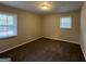 Well-lit bedroom with carpet and two windows at 4433 Mercer Rd, Decatur, GA 30035
