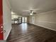 Open living room with laminate wood floors and access to the kitchen at 4433 Mercer Rd, Decatur, GA 30035