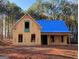 New house under construction, featuring a front porch and a traditional design at 1563 South Bethany Rd, Mcdonough, GA 30252