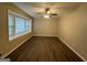 Living room with hardwood floors and large bay window at 3691 Fred Walker Sw Dr, Smyrna, GA 30082
