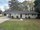 House exterior showcasing a gray brick facade and landscaping at 3691 Fred Walker Sw Dr, Smyrna, GA 30082