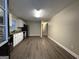 Open concept kitchen and dining area with wood-look flooring at 3691 Fred Walker Sw Dr, Smyrna, GA 30082