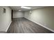 Finished basement area with laminate flooring at 3691 Fred Walker Sw Dr, Smyrna, GA 30082