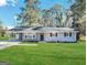 Charming ranch home with a well-maintained lawn at 3691 Fred Walker Sw Dr, Smyrna, GA 30082