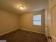 Spacious bedroom with neutral walls and carpet flooring at 2997 Tara Woods Dr, Douglasville, GA 30135