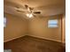 Large main bedroom with neutral decor and carpet flooring at 2997 Tara Woods Dr, Douglasville, GA 30135
