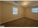 Well-lit bedroom with carpet flooring and neutral tones at 2997 Tara Woods Dr, Douglasville, GA 30135