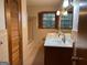 Bathroom with double vanity and hexagon tile floor at 9267 Westview Sw Dr, Covington, GA 30014