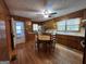 Wood kitchen with round table, stainless steel appliances, and hardwood floors at 9267 Westview Sw Dr, Covington, GA 30014