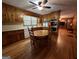 Wood kitchen with island, stainless steel appliances, and hardwood floors at 9267 Westview Sw Dr, Covington, GA 30014