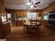 Wood kitchen with island, stainless steel appliances, and hardwood floors at 9267 Westview Sw Dr, Covington, GA 30014