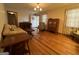Living room with hardwood floors, comfy seating, and a piano at 9267 Westview Sw Dr, Covington, GA 30014
