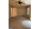 Spacious living room with neutral carpet and ceiling fan at 554 Forest Hill Dr, Stockbridge, GA 30281