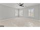 Spacious bedroom with carpet, ceiling fan, and plantation shutters at 1898 Walker Ave, College Park, GA 30337