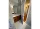 Bathroom featuring a marble countertop vanity and hardwood floors at 5003 Pineview Ter, Fayetteville, GA 30214