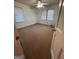 Carpeted bedroom with ceiling fan and large windows at 5003 Pineview Ter, Fayetteville, GA 30214