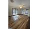 Large bedroom with vinyl plank flooring, ceiling fan and windows at 5003 Pineview Ter, Fayetteville, GA 30214