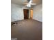 Carpeted bedroom with ceiling fan, closet, and access to other rooms at 5003 Pineview Ter, Fayetteville, GA 30214