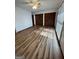 Bright bedroom with hardwood flooring, ceiling fan, and double closets at 5003 Pineview Ter, Fayetteville, GA 30214