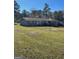 Back of house with deck and large yard at 5003 Pineview Ter, Fayetteville, GA 30214