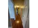 Hallway with hardwood floors and doors to bedrooms and bath at 5003 Pineview Ter, Fayetteville, GA 30214