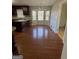 Eat-in kitchen with granite countertops, dark wood cabinets, and hardwood floors at 5003 Pineview Ter, Fayetteville, GA 30214