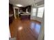 Eat-in kitchen with granite countertops, dark wood cabinets, and hardwood floors at 5003 Pineview Ter, Fayetteville, GA 30214