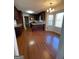 Eat-in kitchen with granite countertops, dark wood cabinets, and hardwood floors at 5003 Pineview Ter, Fayetteville, GA 30214