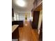 Eat-in kitchen with granite countertops, dark wood cabinets, and hardwood floors at 5003 Pineview Ter, Fayetteville, GA 30214