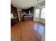 Eat-in kitchen with granite countertops, dark wood cabinets, and hardwood floors at 5003 Pineview Ter, Fayetteville, GA 30214