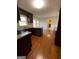 Eat-in kitchen with granite countertops, dark wood cabinets, and hardwood floors at 5003 Pineview Ter, Fayetteville, GA 30214