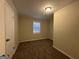 Bright bedroom with neutral carpeting and window blinds at 5950 Community Se Rd, Mableton, GA 30126
