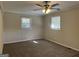 Bedroom with neutral carpeting and two windows at 5950 Community Se Rd, Mableton, GA 30126