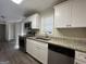 Updated kitchen with granite countertops and white cabinets at 5950 Community Se Rd, Mableton, GA 30126