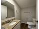 Updated bathroom with granite vanity and flooring at 2190 Westover Dr, East Point, GA 30344