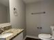 Simple bathroom with granite vanity and updated toilet at 2190 Westover Dr, East Point, GA 30344