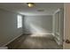 Cozy bedroom with neutral walls, plush carpeting and built-in shelving at 2190 Westover Dr, East Point, GA 30344